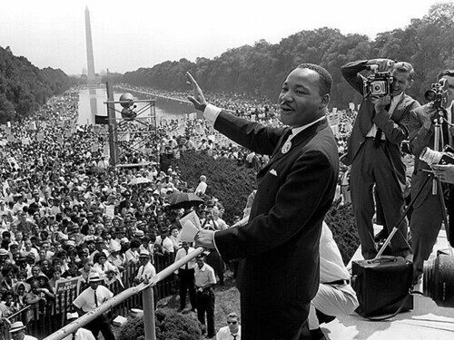 Martin Luther King Jr. speaking to a massive crowd at the Lincoln Memorial during a civil rights rally.
