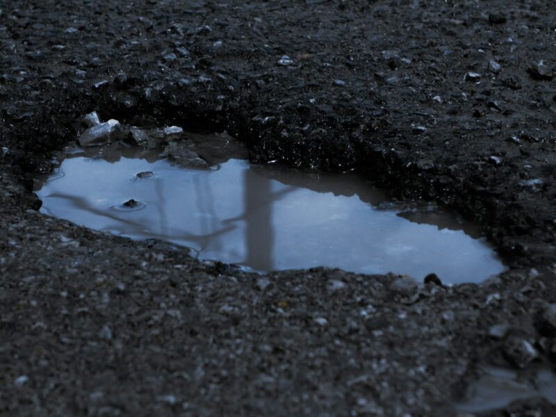 a puddle of water on the ground