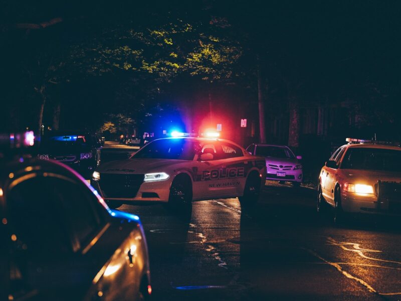 A couple of police cars parked in a parking lot