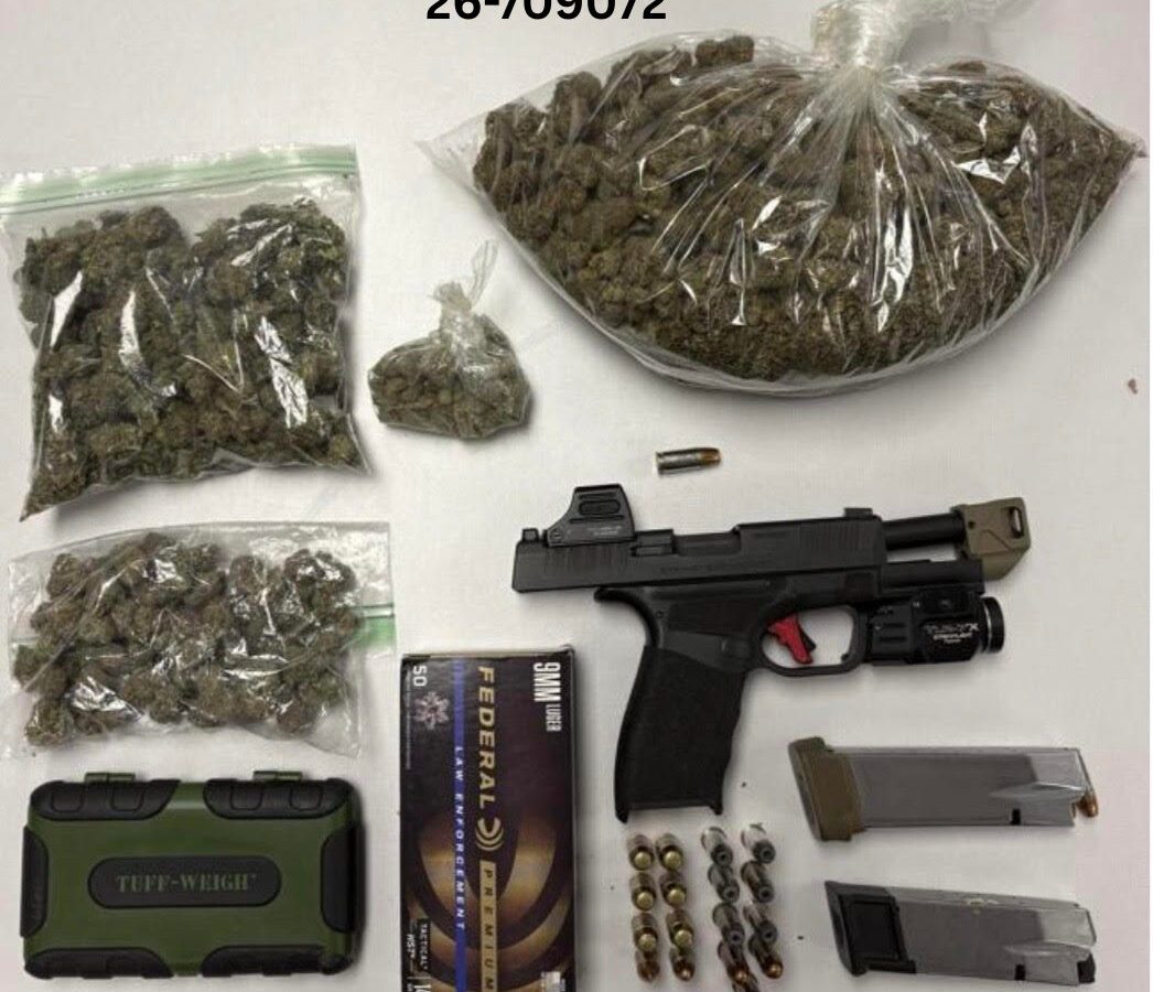 Bagged cannabis, handgun, ammunition, and magazines laid out on a white surface.
