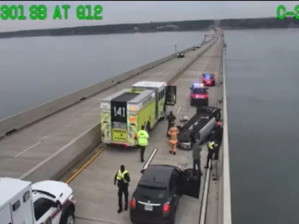 One injured after car overturns on Harry W. Nice Bridge