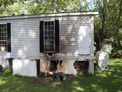 A Gasoline container fire damaged a mobile home in North East