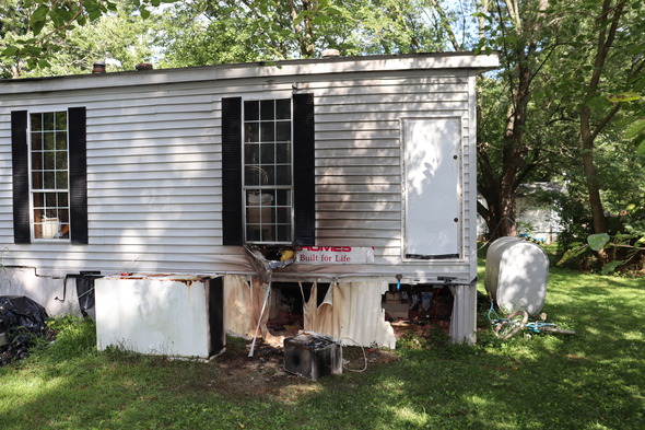 A Gasoline container fire damaged a mobile home in North East